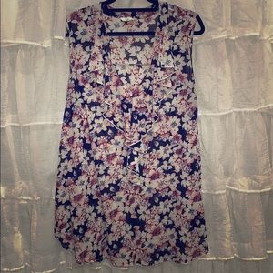 Flowing blouse with ruffles at the top.